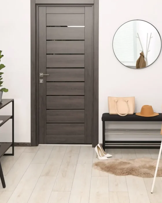 Clothing rack, mirror, houseplant and stylish furniture in hallway